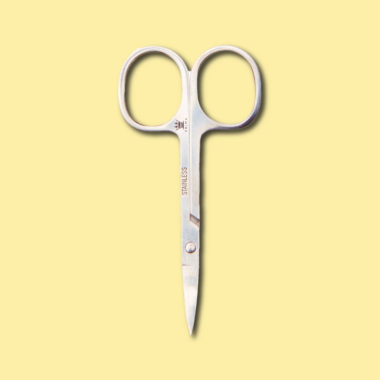prima lash scissors unpacked yellow background